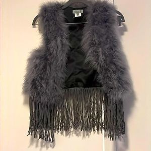 Children’s faux fur and suede vest with tassels.